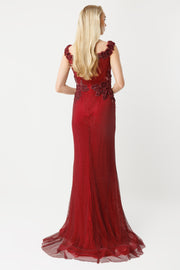 Off-the-shoulder long evening dress with appliqué and slit.