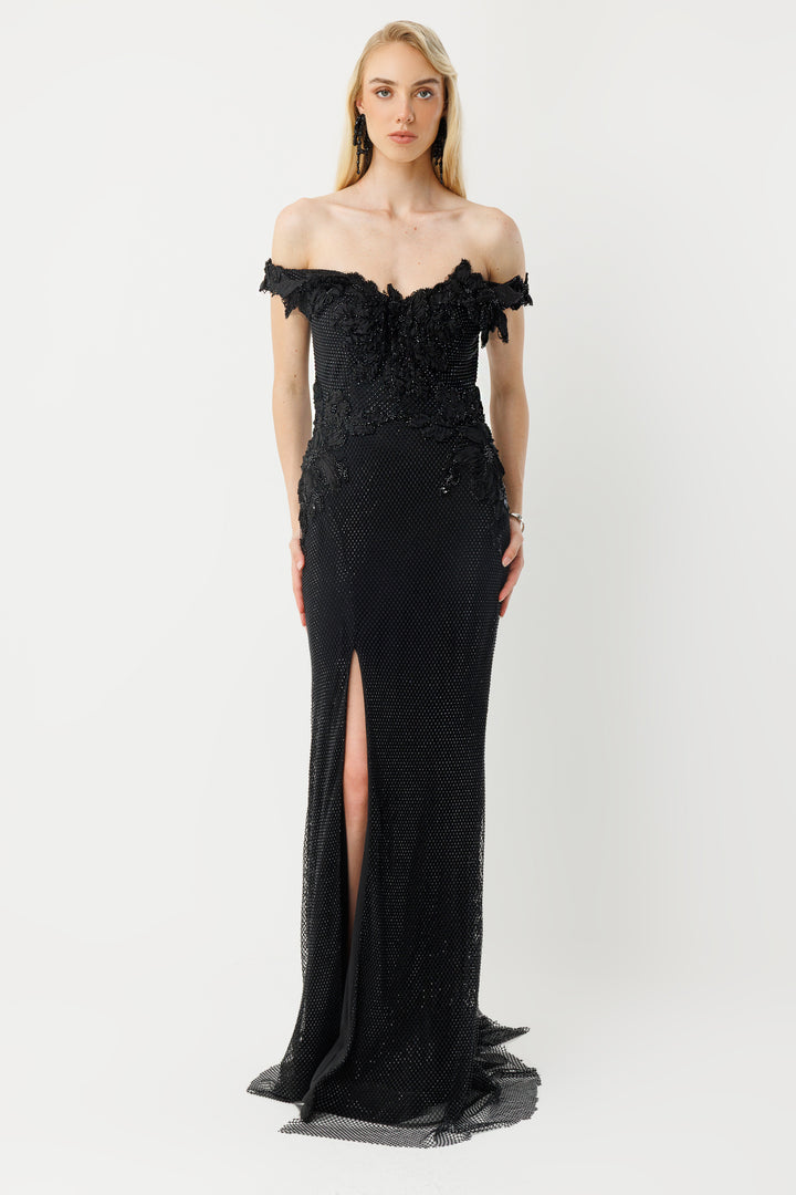 Off-the-shoulder long evening dress with appliqué and slit.