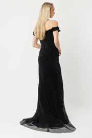 Off-the-shoulder long evening dress with appliqué and slit.