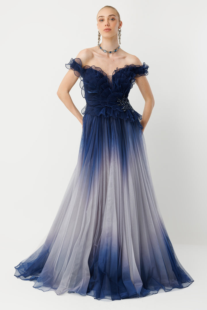 Off-the-shoulder couture navy gradient evening gown with ruffle detail.