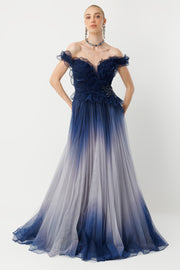 Off-the-shoulder couture navy gradient evening gown with ruffle detail.